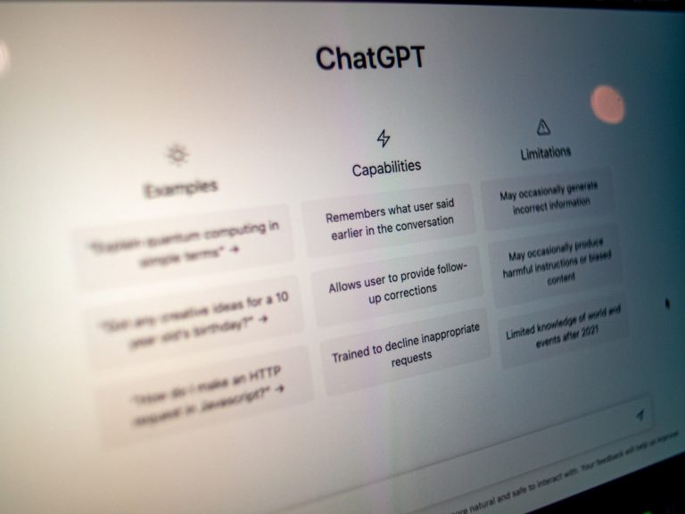 A Discord server open on a laptop screen in a dark room